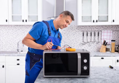 mature-handyman-repairing-microwave-oven_1016675-2994